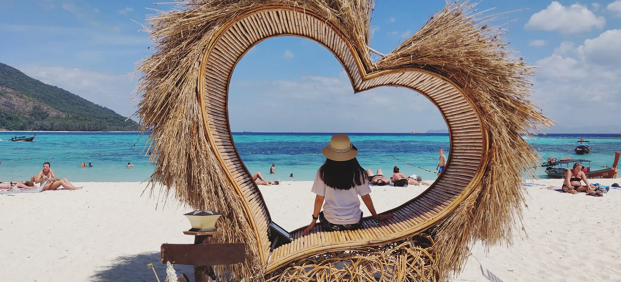 a person sitting on a bench at the beach | Top Marketing Automation Agency